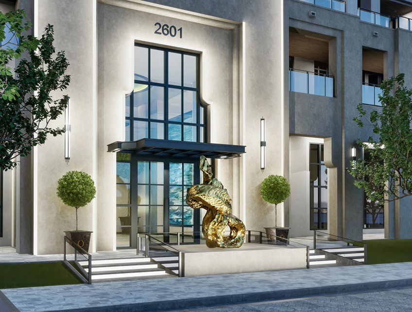 exterior entrance of a building with a golden statue in front of it