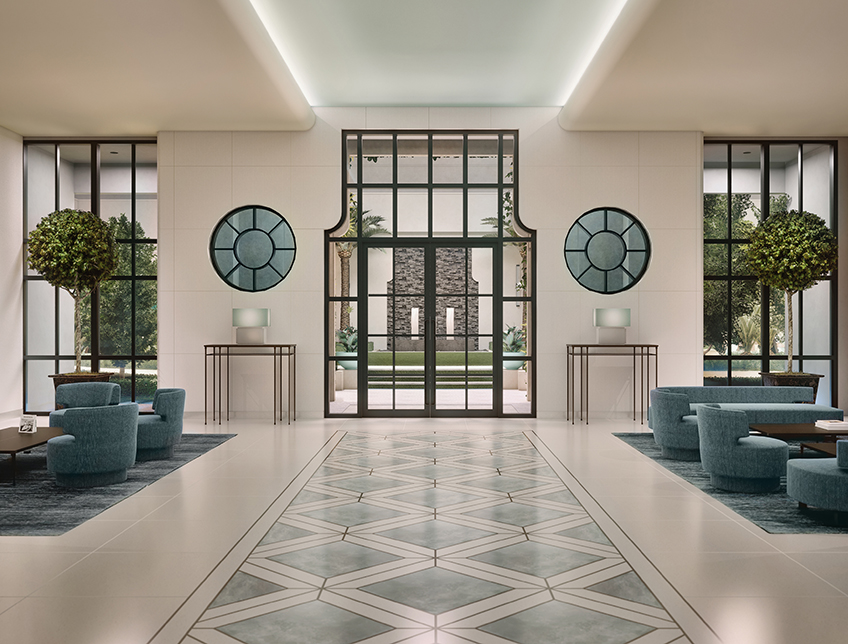 Lobby of a building with mint green chairs, floor, and decorations